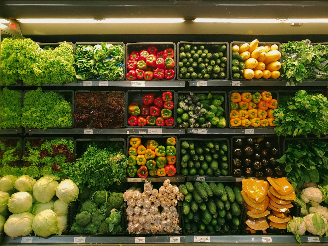 Crates full of fresh vegetables at a greengrocer